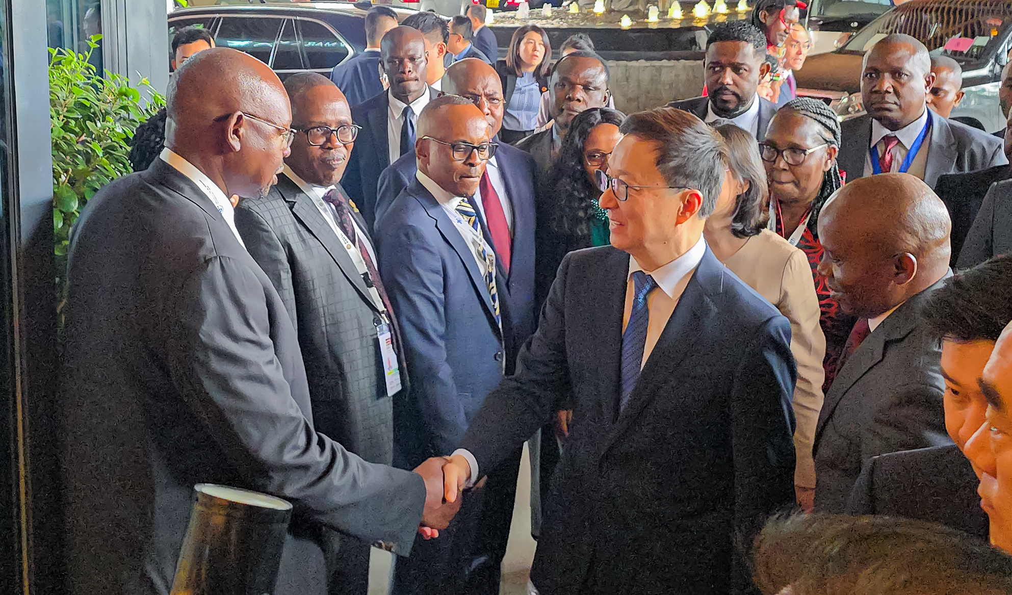 High-level handshake between international delegations at a KNCCI event